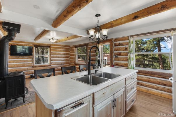Chandelier, Dining room, Interior, Kitchen, Pendant Lights, Wooden Beams, Wood Texture Flooring, Wooden Walls