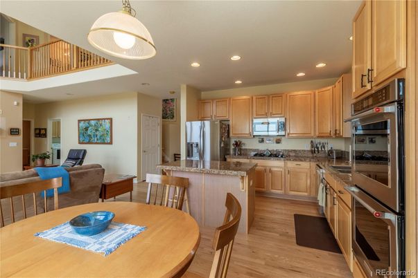 Dining room, Interior, Kitchen, Recessed Lighting, Stainless Steel Appliances, Wood Texture Flooring
