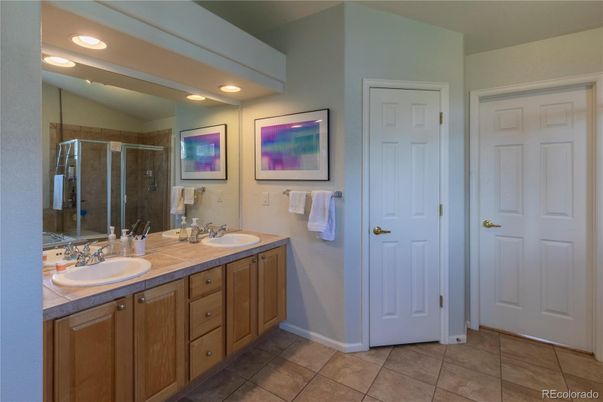 Bathroom, Dual Sink Vanities, Glass Shower, Interior, Recessed Lighting, Tile Countertops