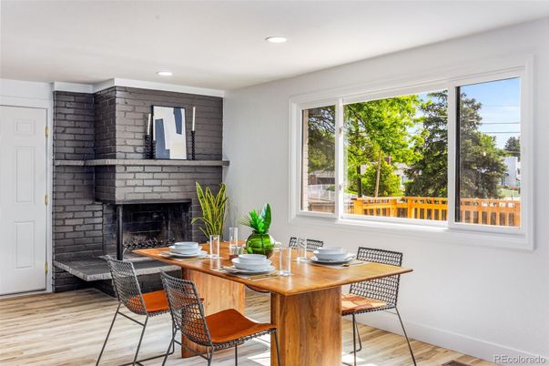 Dining room, Fireplace, Interior, Recessed Lighting, Stone Walls, Wood Texture Flooring