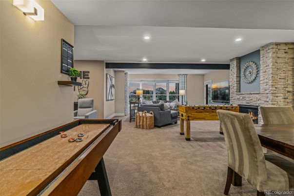 Fireplace, Game Room, Interior, Living room, Recessed Lighting, Stone Walls