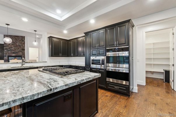 Interior, Kitchen, Pendant Lights, Recessed Lighting, Stainless Steel Appliances, Stone Walls, Wood Texture Flooring