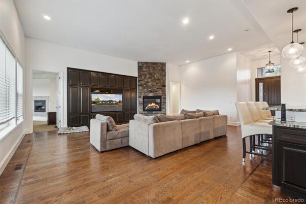Fireplace, Interior, Living room, Pendant Lights, Recessed Lighting, Stone Walls, Wood Texture Flooring