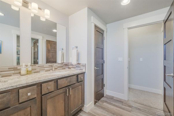 Bathroom, Dual Sink Vanities, Interior, Recessed Lighting, Wood Texture Flooring