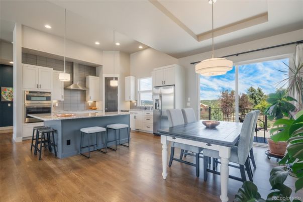 Dining room, Interior, Kitchen, Pendant Lights, Recessed Lighting, Stainless Steel Appliances, Wood Texture Flooring