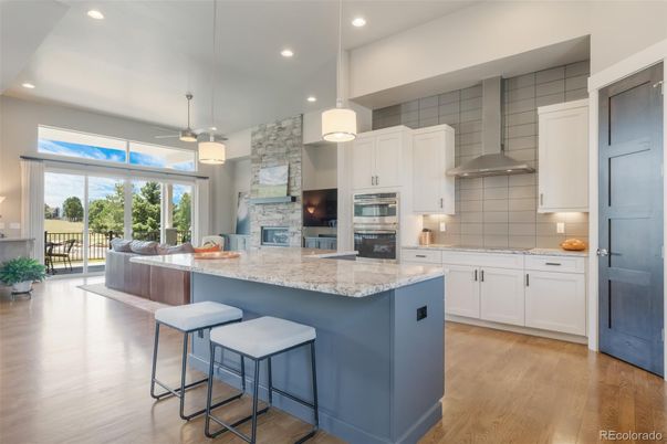 Dining room, Fireplace, Interior, Kitchen, Pendant Lights, Recessed Lighting, Stainless Steel Appliances, Stone Walls, Wood Texture Flooring