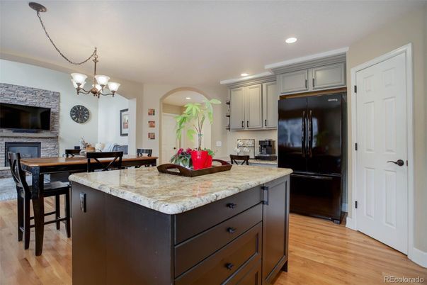 Chandelier, Dining room, Fireplace, Interior, Kitchen, Recessed Lighting, Wood Texture Flooring