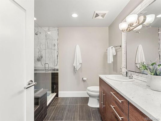 Bathroom, Dual Sink Vanities, Glass Shower, Interior, Marble Walls, Recessed Lighting