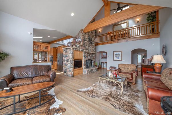 Fireplace, Interior, Living room, Recessed Lighting, Stone Walls, Wooden Beams, Wood Texture Flooring