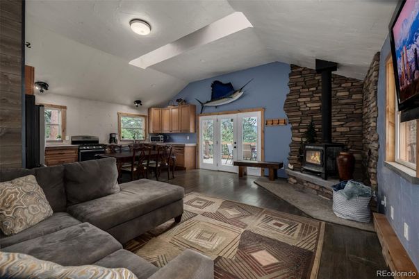 Dining room, Fireplace, Interior, Kitchen, Living room, Stone Walls, Wood Texture Flooring