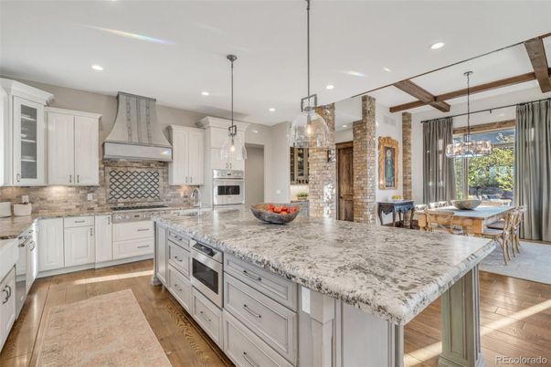 Dining room, Interior, Kitchen, Pendant Lights, Recessed Lighting, Stainless Steel Appliances, Stone Walls, Wooden Beams, Wood Texture Flooring