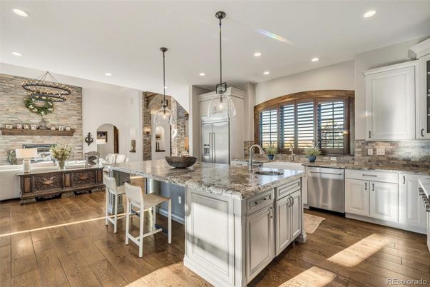Interior, Kitchen, Pendant Lights, Recessed Lighting, Stainless Steel Appliances, Stone Walls, Wood Texture Flooring