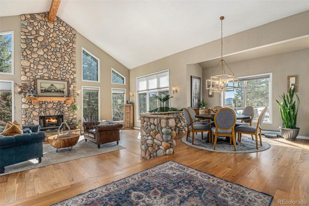 Dining room, Fireplace, Interior, Living room, Pendant Lights, Stone Walls, Wood Texture Flooring