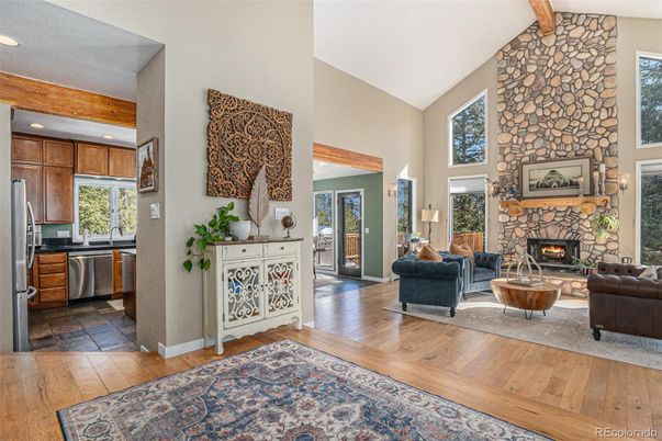 Fireplace, Interior, Kitchen, Living room, Recessed Lighting, Stainless Steel Appliances, Stone Walls, Wooden Beams, Wood Texture Flooring
