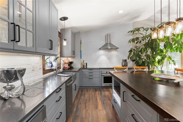 Interior, Kitchen, Pendant Lights, Recessed Lighting, Stainless Steel Appliances, Wood Texture Flooring