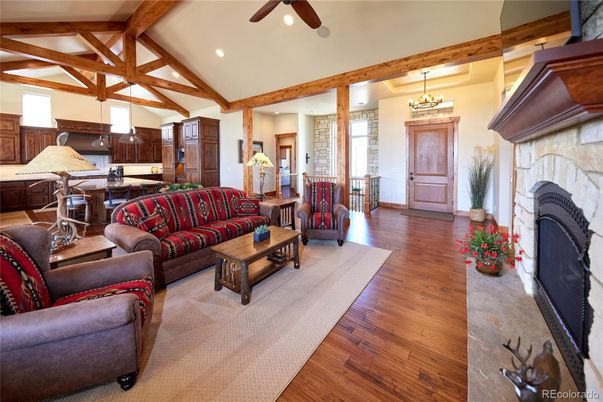 Chandelier, Fireplace, Interior, Kitchen, Living room, Pendant Lights, Recessed Lighting, Wooden Beams, Wood Texture Flooring