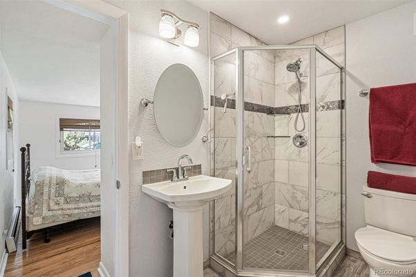 Bathroom, Glass Shower, Interior, Marble Walls, Recessed Lighting, Wood Texture Flooring