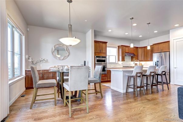 Dining room, Interior, Kitchen, Pendant Lights, Recessed Lighting, Stainless Steel Appliances, Wood Texture Flooring