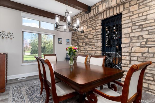 Chandelier, Dining room, Interior, Pendant Lights, Stone Walls, Wine Storage, Wooden Beams, Wood Texture Flooring