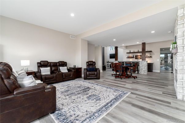 Dining room, Interior, Living room, Recessed Lighting, Stone Walls, Wood Texture Flooring