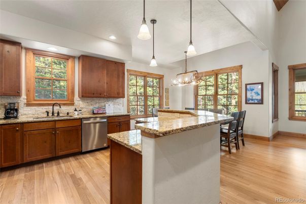 Dining room, Interior, Kitchen, Pendant Lights, Recessed Lighting, Stainless Steel Appliances, Wood Texture Flooring