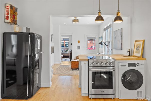 Interior, Kitchen, Pendant Lights, Stainless Steel Appliances, Washer, Wood Texture Flooring