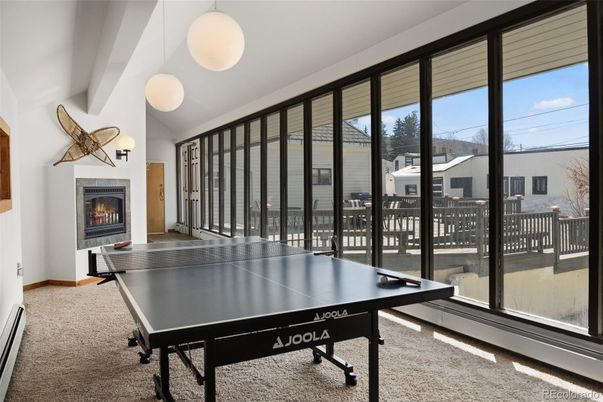 Fireplace, Game Room, Interior, Pendant Lights