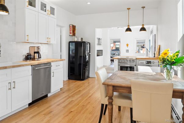 Dining room, Interior, Kitchen, Pendant Lights, Recessed Lighting, Stainless Steel Appliances, Wood Texture Flooring