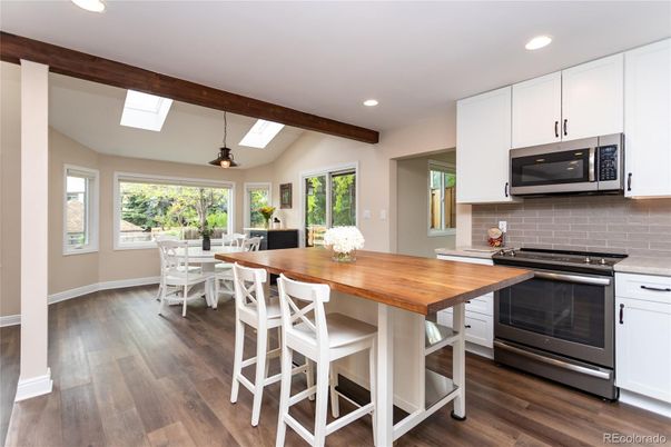 Dining room, Interior, Kitchen, Pendant Lights, Recessed Lighting, Stainless Steel Appliances, Wooden Beams, Wood Texture Flooring