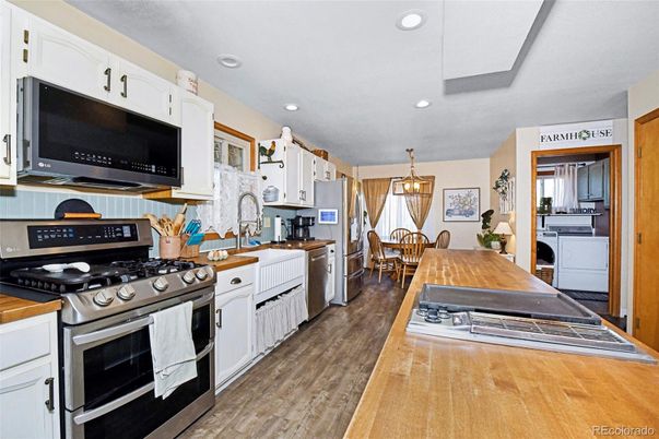Dining room, Interior, Kitchen, Pendant Lights, Recessed Lighting, Stainless Steel Appliances, Wood Texture Flooring