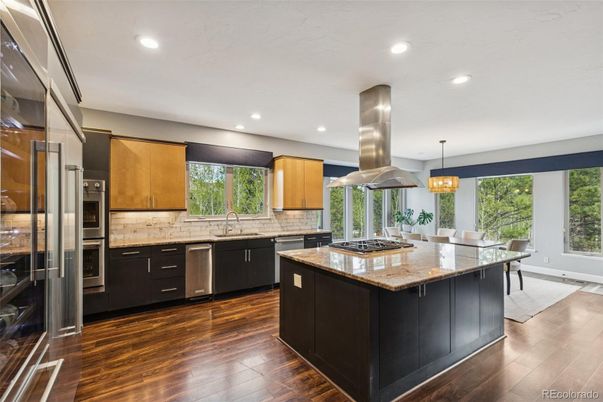 Dining room, Interior, Kitchen, Pendant Lights, Recessed Lighting, Stainless Steel Appliances, Wood Texture Flooring