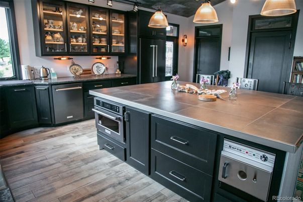 Interior, Kitchen, Pendant Lights, Tile Countertops, Wood Texture Flooring