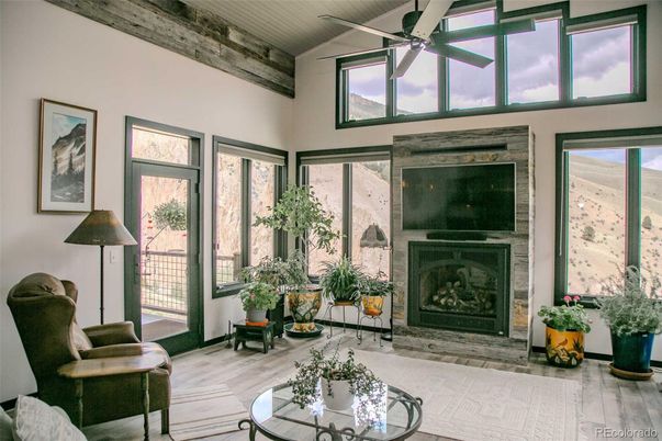 Fireplace, Interior, Sun Room, Wood Texture Flooring