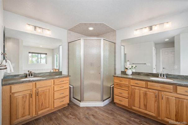 Bathroom, Dual Sink Vanities, Glass Shower, Interior, Recessed Lighting, Wood Texture Flooring