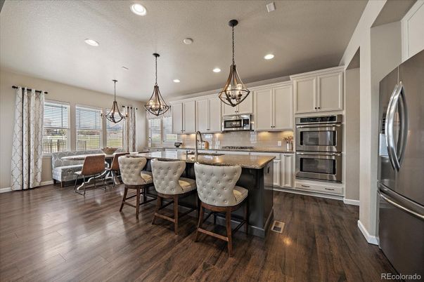 Chandelier, Dining room, Interior, Kitchen, Pendant Lights, Recessed Lighting, Stainless Steel Appliances, Wood Texture Flooring