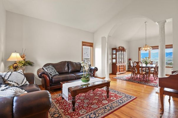 Chandelier, Dining room, Interior, Living room, Pendant Lights, Piano, Water, Wood Texture Flooring