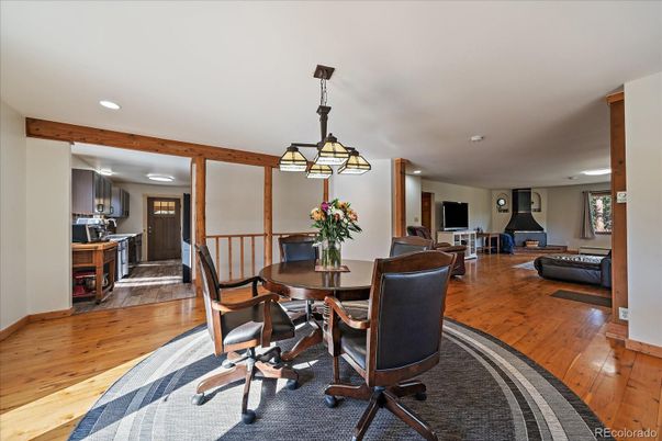 Dining room, Fireplace, Interior, Living room, Pendant Lights, Recessed Lighting, Wooden Beams, Wood Texture Flooring