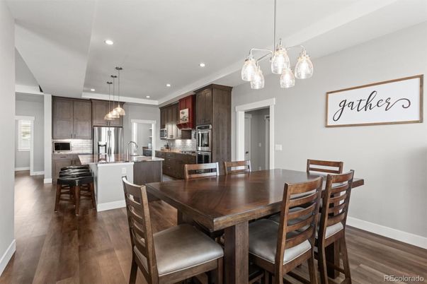 Dining room, Interior, Kitchen, Pendant Lights, Recessed Lighting, Stainless Steel Appliances, Wood Texture Flooring