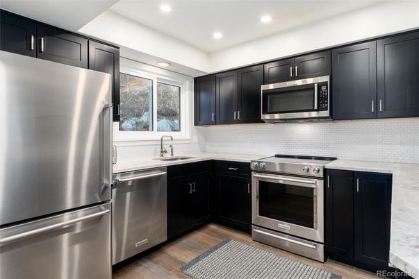 Interior, Kitchen, Recessed Lighting, Stainless Steel Appliances, Wood Texture Flooring