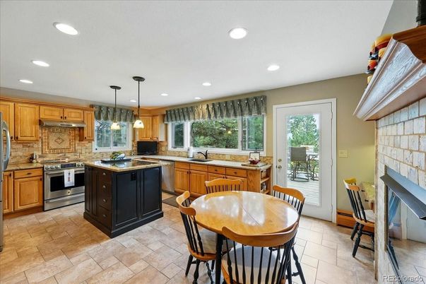 Dining room, Fireplace, Interior, Kitchen, Pendant Lights, Recessed Lighting, Stainless Steel Appliances