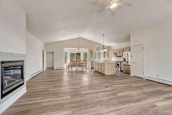 Chandelier, Dining room, Interior, Kitchen, Pendant Lights, Stainless Steel Appliances, Wood Texture Flooring
