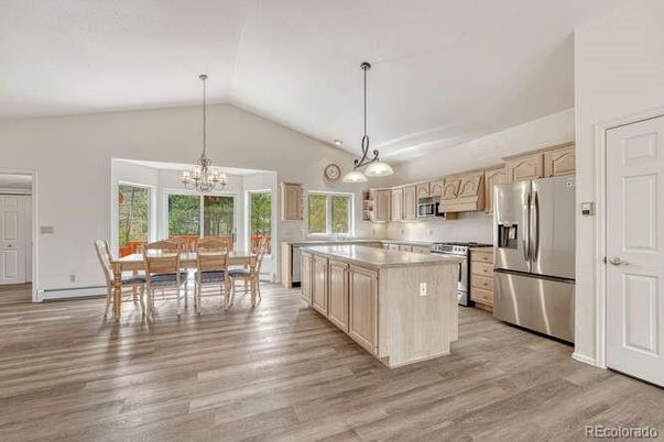 Chandelier, Dining room, Interior, Kitchen, Pendant Lights, Stainless Steel Appliances, Wood Texture Flooring