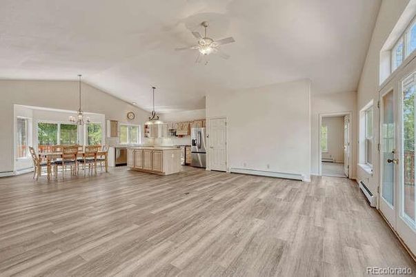 Chandelier, Dining room, Interior, Kitchen, Pendant Lights, Stainless Steel Appliances, Wood Texture Flooring