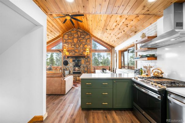 Fireplace, Interior, Kitchen, Living room, Recessed Lighting, Stone Walls, Wooden Ceilings, Wood Texture Flooring