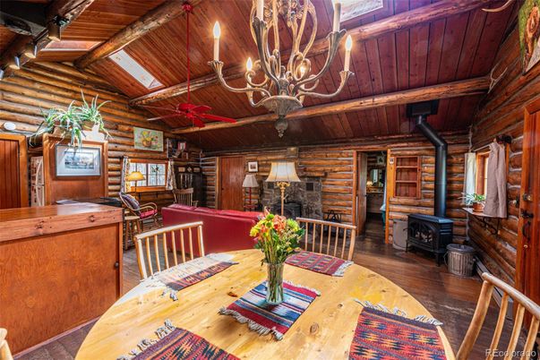 Chandelier, Dining room, Fireplace, Interior, Wooden Beams, Wooden Ceilings, Wood Texture Flooring, Wooden Walls