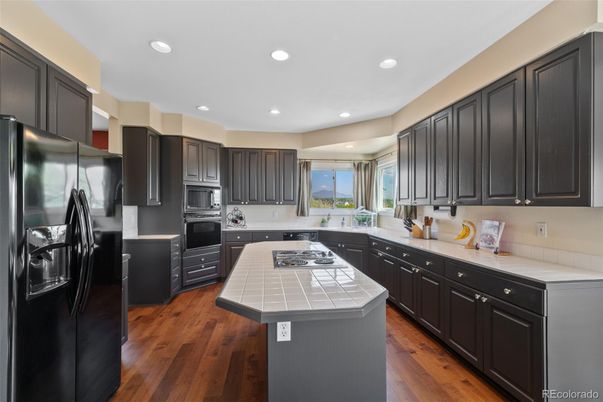 Interior, Kitchen, Recessed Lighting, Stainless Steel Appliances, Tile Countertops, Wood Texture Flooring