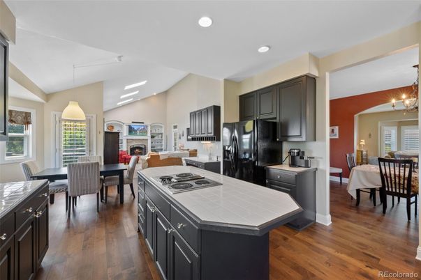 Dining room, Fireplace, Interior, Kitchen, Living room, Pendant Lights, Recessed Lighting, Tile Countertops, Wood Texture Flooring