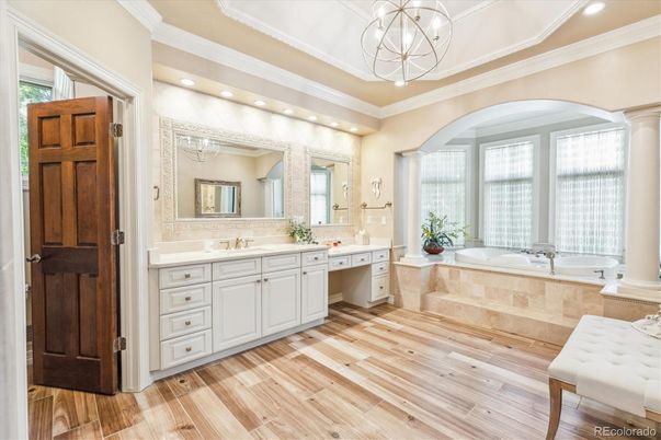 Bathroom, Chandelier, Dual Sink Vanities, Interior, Pendant Lights, Recessed Lighting, Wood Texture Flooring
