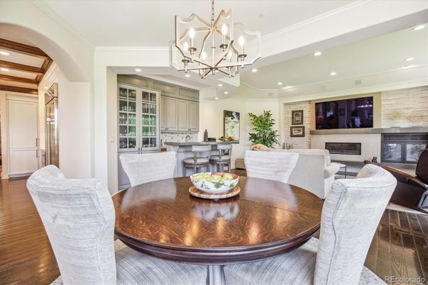 Chandelier, Dining room, Fireplace, Interior, Living room, Recessed Lighting, Wood Texture Flooring