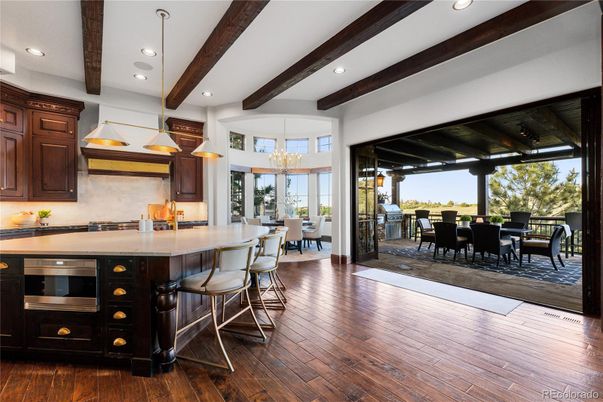 Chandelier, Dining room, Interior, Kitchen, Pendant Lights, Recessed Lighting, Stainless Steel Appliances, Wooden Beams, Wood Texture Flooring
